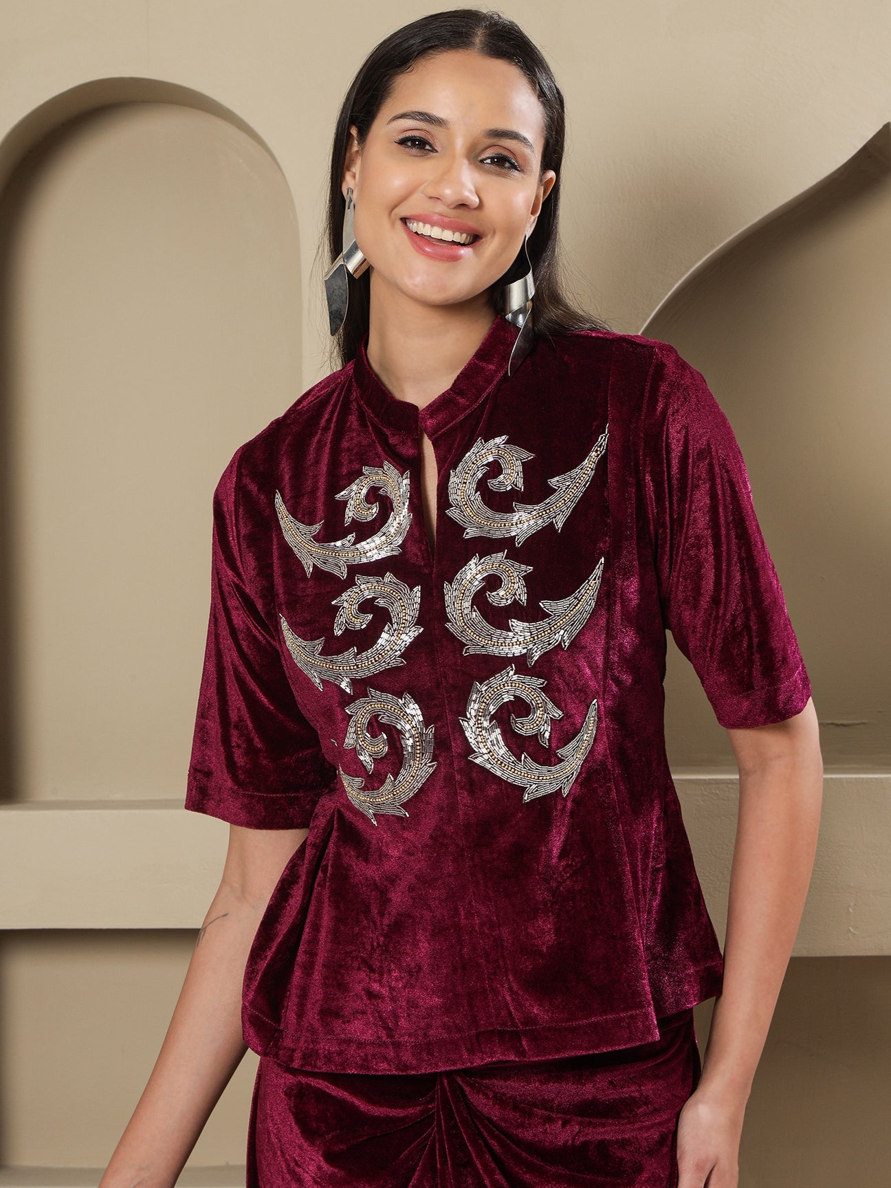 Designer Partywear Wine Velvet Hand-Embellished Top & Draped Knot Skirt Set